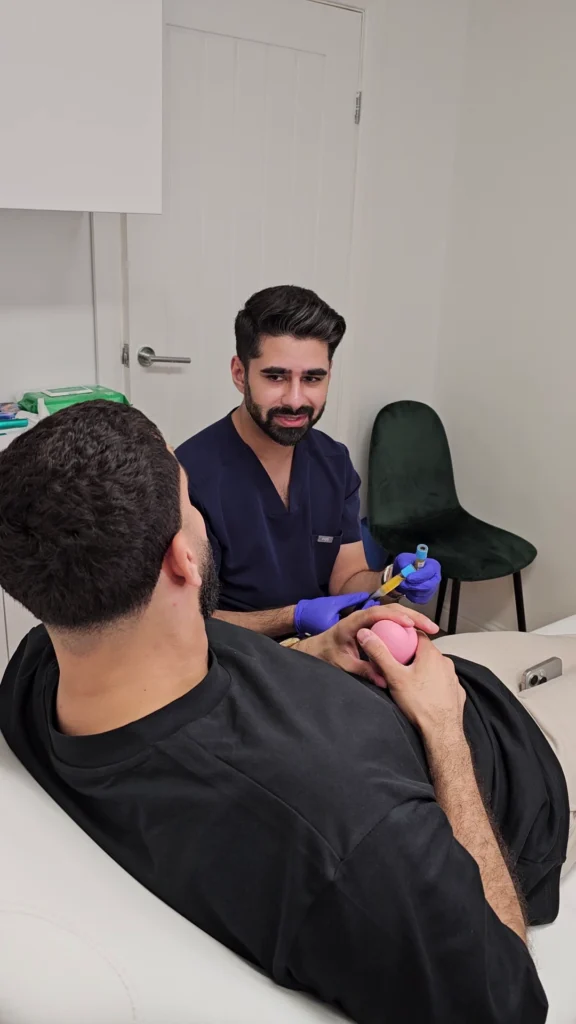 Dr Hussain performing aesthetic consultation at Zorah Clinic Amersham Buckinghamshire