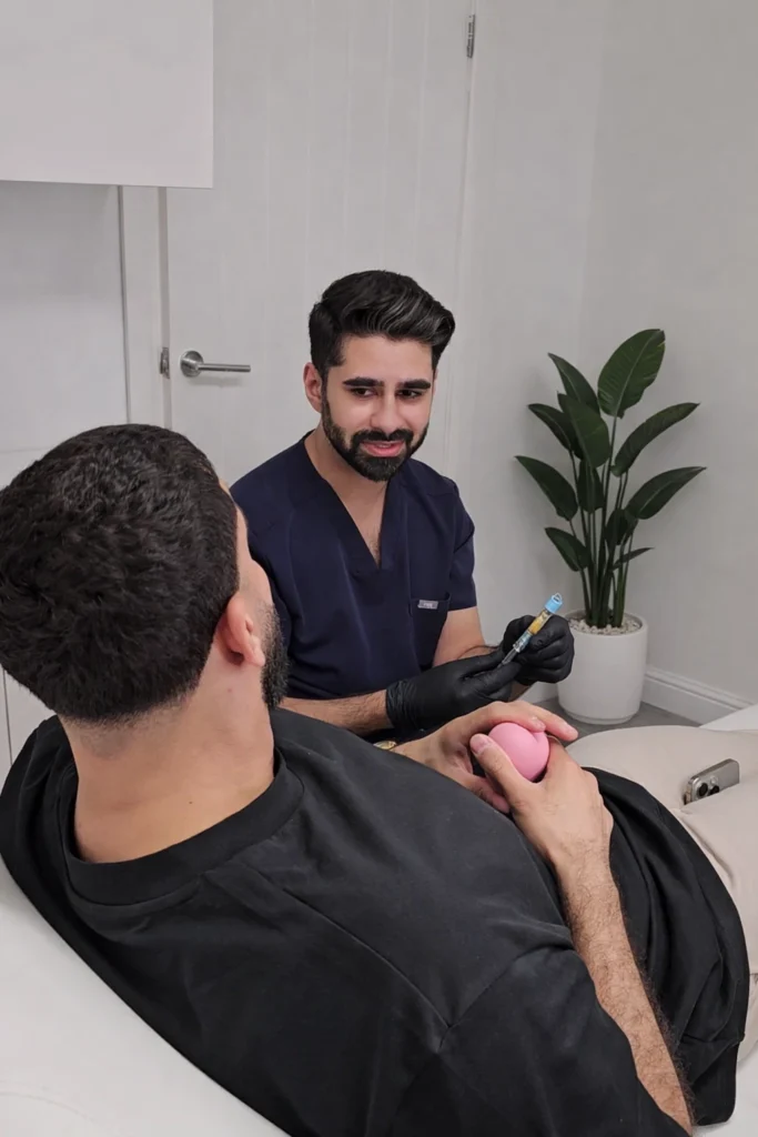 Dr Hussain performing aesthetic consultation at Zorah Clinic Amersham Buckinghamshire